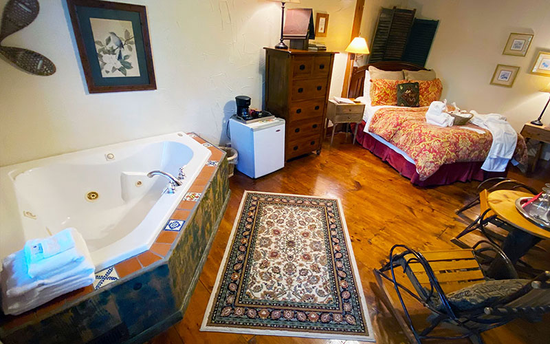 fieldstone room bed, tub, dresser, and fridge