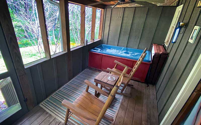 moon eye screened porch with hot tub